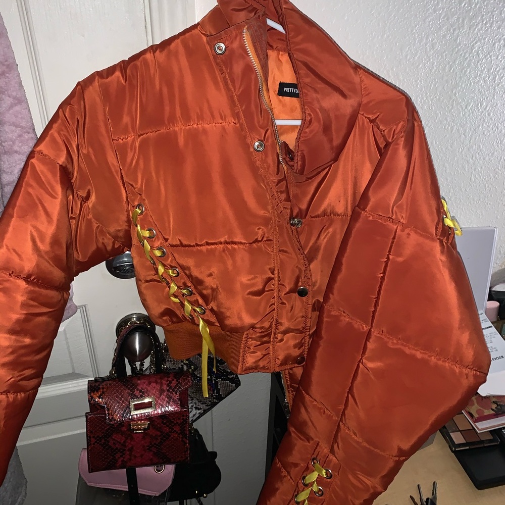 Orange jacket with yellow ribbons
